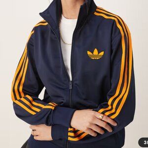 ADIDAS Originals Firebird track suit in navy and orange